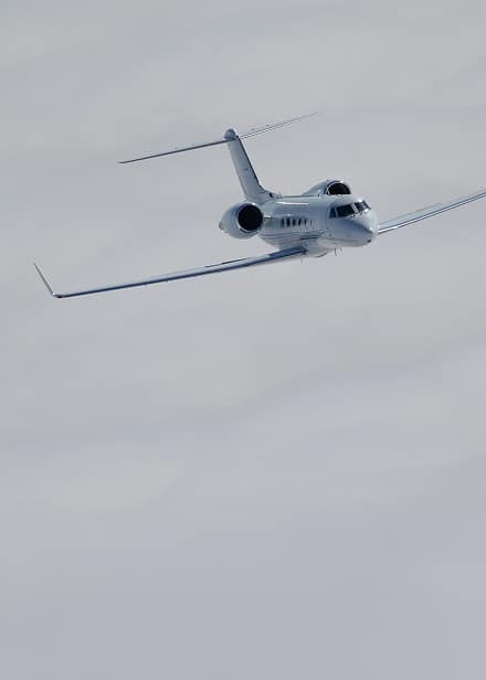 Gulfstream G450 private jet flying above the clouds, representing the simplicity, consistency, and convenience of FLYUSA Ascend Club, a private jet charter membership for frequent travelers.