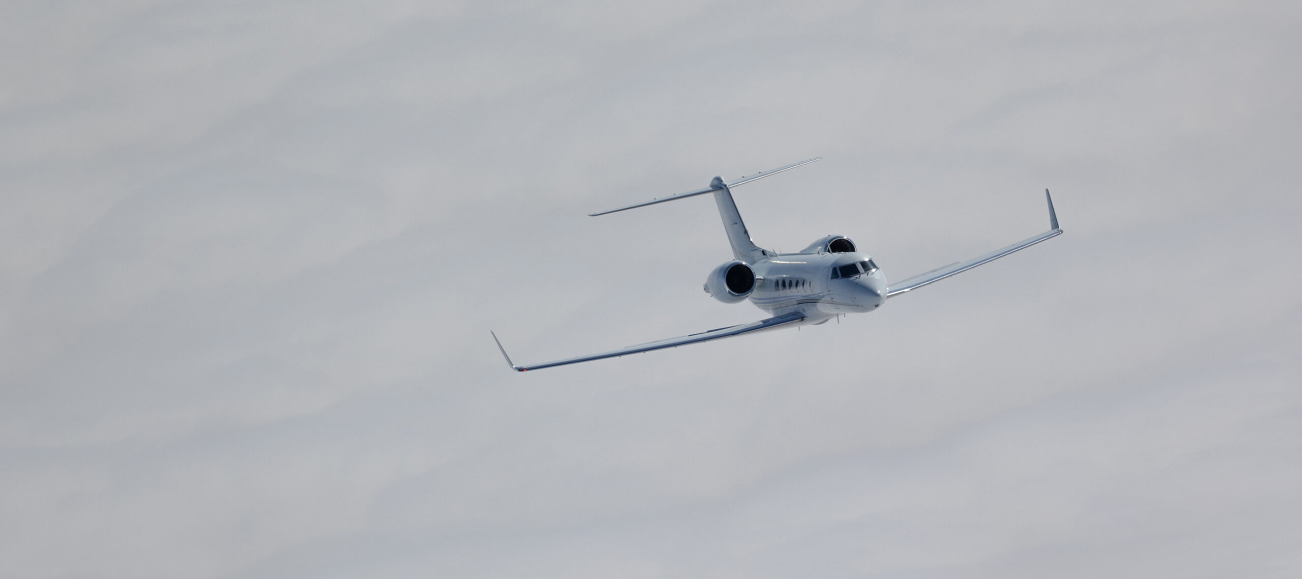 Gulfstream G450 private jet flying above the clouds, representing the simplicity, consistency, and convenience of FLYUSA Ascend Club, a private jet charter membership for frequent travelers.